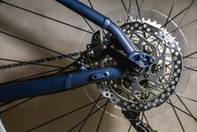 Rear Bicycle Wheel With Hydraulic Disc Brake Rotor On New Blue Frame With Black Latch, Close-up