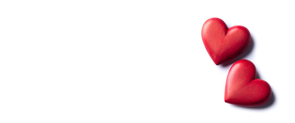Wall Mural - two red wooden hearts on white background - valentine's day