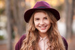 © Scopio - Portrait of smiling teenage girl with purple hat