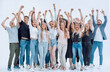 happy group of young people with hands up