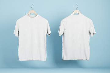 Wall Mural - Empty white t-shirts on blue wall background, Product design and presentation concept. Mock up logo. 3D Rendering.