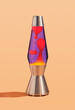 © Dima - Table colorful lava lamp with flowing traceries. Peace and comfort in interior. Retro style.