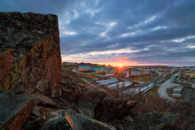 Dawn Over The City Of Anadyr. View From The Rocky Mountainside To The Northern City In The Arctic. Summer Midnight Sun. Travel To The Far North Of Russia. Anadyr, Chukotka, Russia.