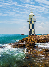 Port Shepstone Lighthouse With Rocky Shore And Turquoise Blue Indian Ocean Water