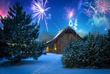 Fototapeta Bambus - New Year's Eve fireworks display over the winter hut in the woods