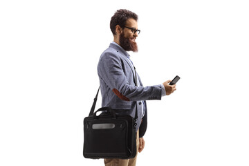 Wall Mural - Man typing on a mobile phone and carrying a laptop bag