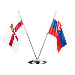 Two table flags isolated on white background 3d illustration, northern ireland and slovakia