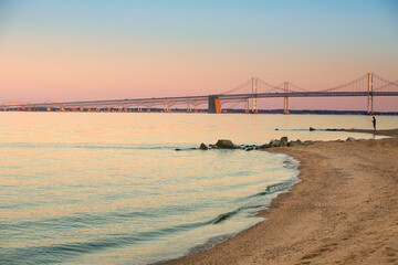 chesapeake bay bridge with calm inlet at sunset