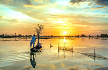 The Ferryman Rowed A Boat To Take Guests Through The Wetlands To Return Home At Sunset, The Idyllic Rural Life In Tay Ninh, Vietnam