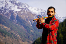 Bansuri Indian Instrument Young Boy Playing Bansuri Indian Flute In Mountains