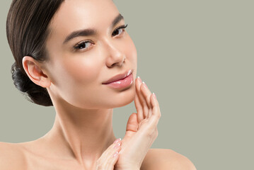 Wall Mural - asia woman beauty face body portrait touching her face healthy skin. color background. green