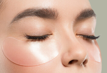 Wall Mural - eyes mask asian woman face cosmetic. color background. green