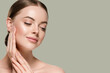 Skin care woman with hands portrait  skin closeup cosmetic age concept. Color background green