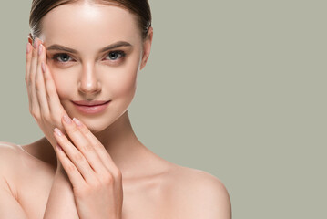 Wall Mural - skin care woman with hands portrait skin closeup cosmetic age concept. color background green