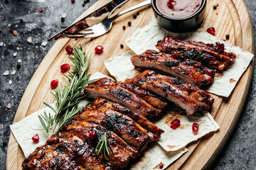 Wall Mural - Spicy rack of spare ribs with BBQ sauce served on wood chopping board, Restaurant menu, dieting, cookbook recipe top view