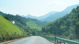 Fototapeta Tęcza - One countryside road across the mountains in the countryside of the China in spring