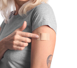 mature woman with applied nicotine patch on white background, closeup. smoking cessation