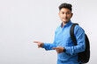 © PRASANNAPIX - Young indian college student giving expression on white background.