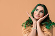 © Pixel-Shot - Beautiful young woman with unusual green hair on color background