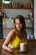 © ksenija1803z - portrait of woman with smartphone and glass of coffee latte