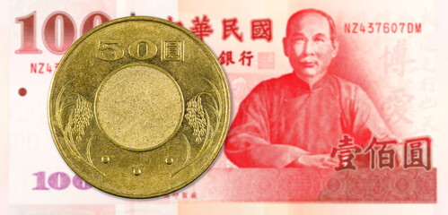 Wall Mural - 50 taiwan dollar coin against 100 taiwan dollar banknote indicating growing economics