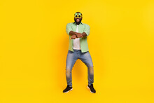 Full Size Photo Of Excited Positive Guy Enjoy Dancing Crossed Fists Make Moves Toothy Smile Isolated On Yellow Color Background