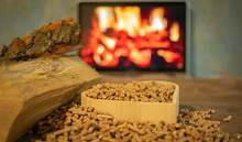 Heating A Wood Stove With Pellets In The Foreground - An Economical Concept Of The Heating System