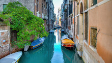 A Small Canal In Venice With Beautiful Colorful Houses, Italy. Venice Is A City In Northeastern Italy And The Capital Of The Veneto Region.