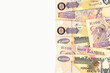 some 100 zambia kwacha bank notes with copyspace to the left on white background