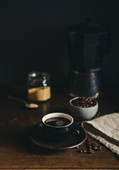 Wall Mural - Cup of black coffee on rustic wooden table
