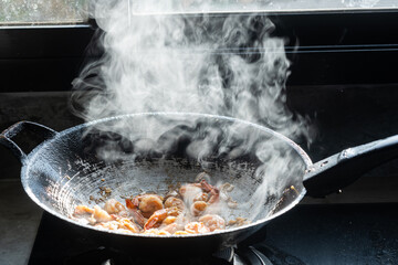 Close up of shrimps in frying pan. Close up of cooked prawns. Macro food background. Seafood.hot food