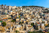 Fototapeta Miasto - Panorama of Mount of Olives with Siloam village over Kidron Valley seen from south wall of Temple Mount in Jerusalem Old City in Israel