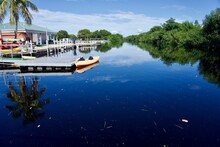 Everglades National Park, Flamingo Visitors Center Marina With A Kayak Docked In Blue Waters Of Buttonwood Canal. 