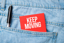 The Back Pocket Of Blue Jeans Contains A White Pen And A White Red Card With The Text Keep Moving