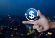 Leinwandbild Motiv Money transfer flat icon on finger over blur colorful night light modern city tower and skyscraper, Business currency exchange service concept