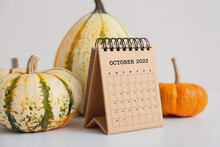 Craft Calendar For October 2022 And Pumpkins On Light Background
