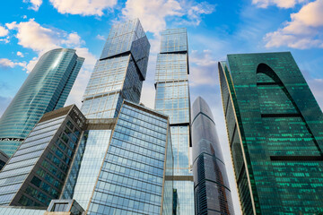 Wall Mural - Downtown in Moscow. Skyscrapers of Russia. Architecture of Moscow business district. Russian architecture. Skyscrapers on blue sky background. Business real estate of capital of Russia.