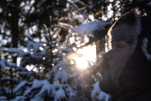 Latin American Man Whistling In A Winter Forest 