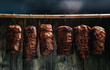 © Надія Коваль - Traditionally smoked meats pork ham. Smoked ham, bacon, pork neck and sausages in a smokehouse