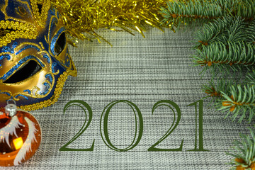 Wall Mural - Summing up the results of 2021. Christmas background with copy space, mask, ball and fir branches.