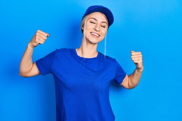 Sticker - Young caucasian woman wearing courier uniform wearing cap very happy and excited doing winner gesture with arms raised, smiling and screaming for success. celebration concept.