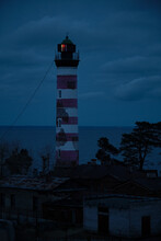Lighthouse On The Seashore In The Evening