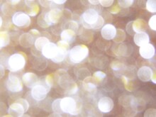 Yellow White Pastel Bokeh Lights Background,blurred Out Of Focus, Shiny Glittery Shimmer Circle Polka Dots Bubbles Shapes.Christmas New Year Holidays Banner. Defocused Golden Glitter Wallpaper Design.