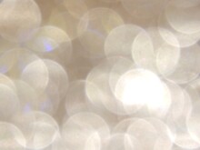 Yellow White Pastel Bokeh Lights Background,blurred Out Of Focus, Shiny Glittery Shimmer Circle Polka Dots Bubbles Shapes.Defocused Golden Glitter Wallpaper Design.Christmas New Year Holidays Banner. 