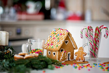 Ginger Bread House With Decoration On The Table, Christmas Spirit