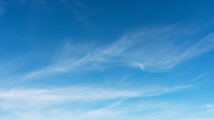 Wall Mural - wispy clouds and blue sky ideal for background or sky substitution
