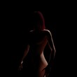 © svetjekolem - Silhouette revealing the shapes of an adult guben female body on a dark background 3d realistic illustration