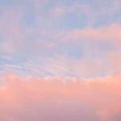 Wall Mural - Background of blue sky with pink clouds in sunset