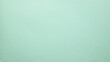 © filins - Smooth flat vintage paper bag pale texture in light blue color on table background.