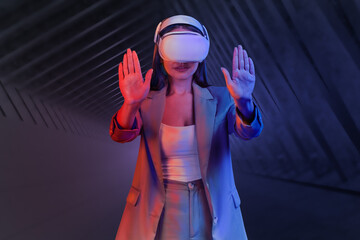 Poster - Businesswoman in formal wear is wearing vr helmet